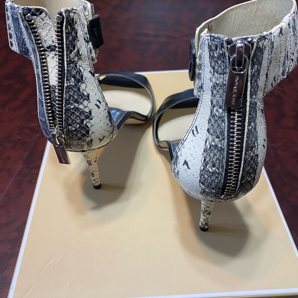 Michael Kors snakeskin and leather pumps.